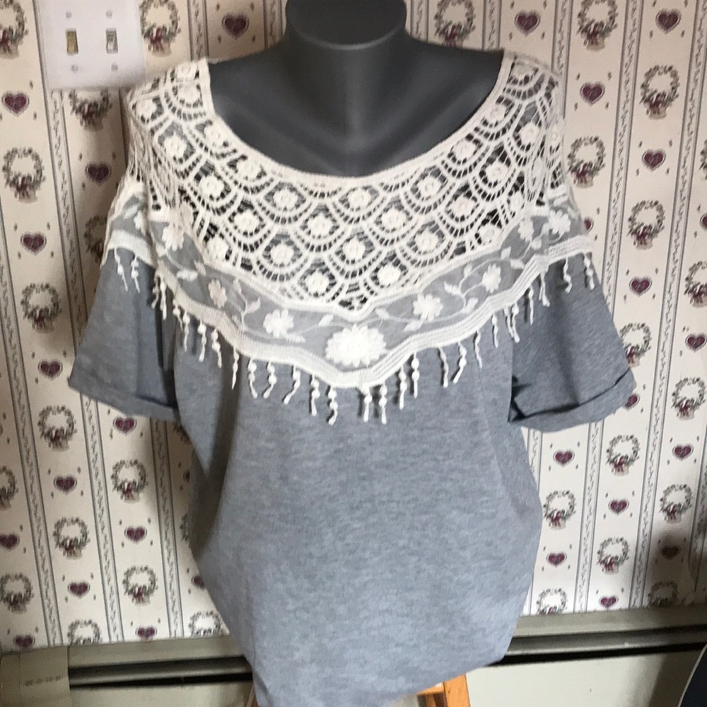 Blouse with crocheting across the top